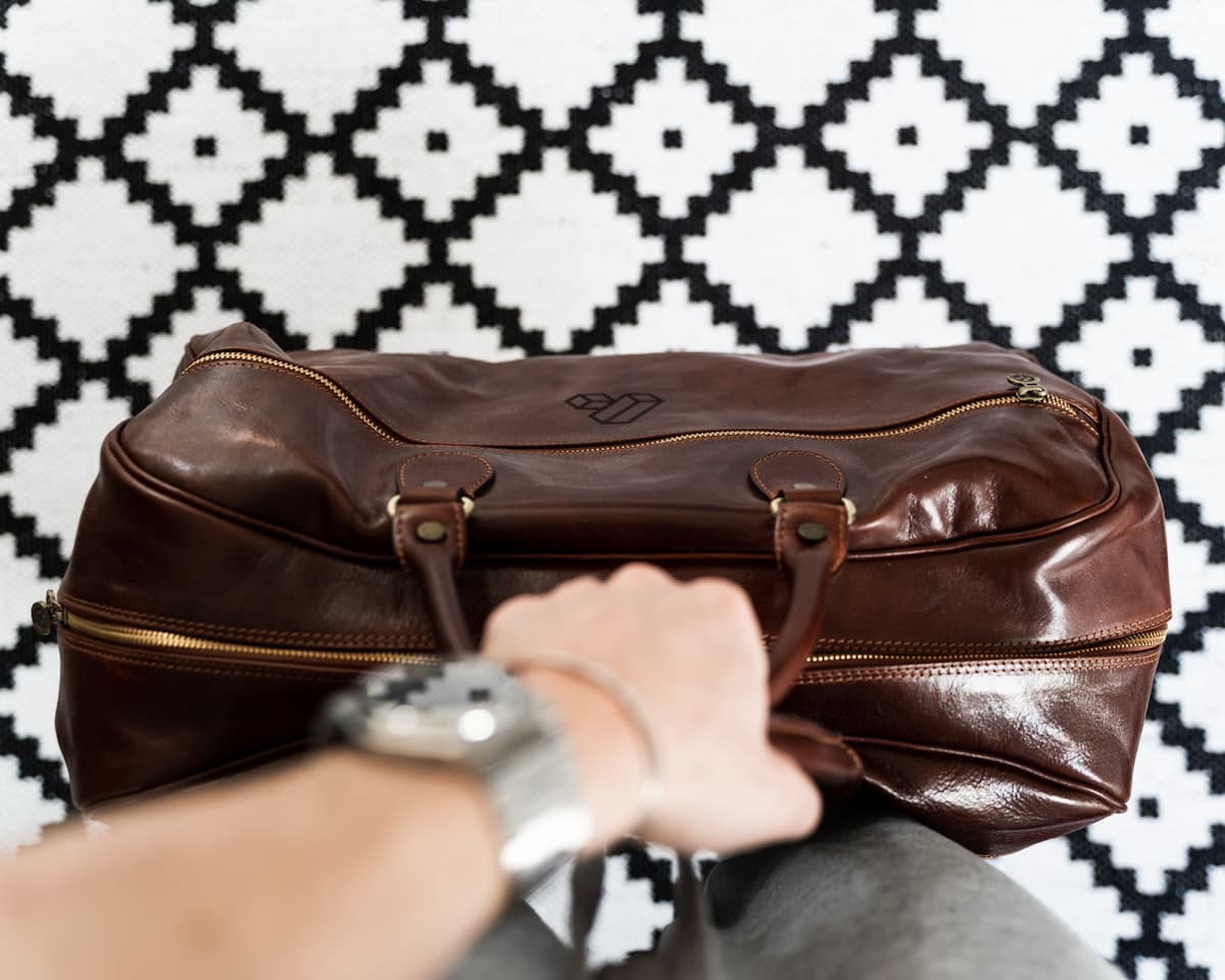 Close look at precision stitching on a leather duffel